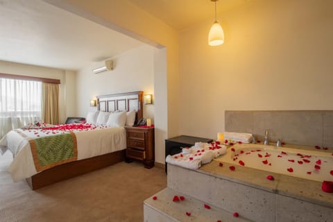 Suite, 1 King Bed, Non Smoking, Hot Tub | Minibar, in-room safe, individually decorated, individually furnished