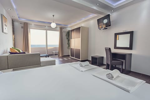 Standard Studio, Partial Sea View | Minibar, in-room safe, individually decorated, individually furnished