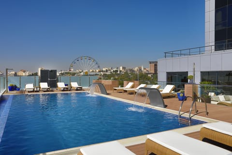 Seasonal outdoor pool, open 10:00 AM to 7:00 PM, sun loungers