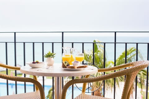 Superior Double Room, Sea View, Oceanfront | Minibar, in-room safe, desk, blackout drapes