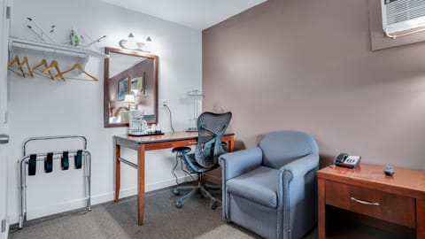 Desk, laptop workspace, blackout drapes, iron/ironing board