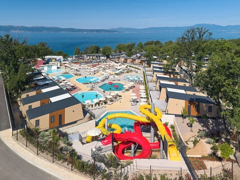 Seasonal outdoor pool, open 10:00 AM to 7:00 PM, pool umbrellas