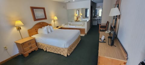 Deluxe Room, 1 Queen Bed, Jetted Tub | Pillowtop beds, iron/ironing board, rollaway beds, free WiFi