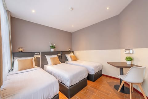 Economy Triple Room (no elevator access) | In-room safe, desk, blackout drapes, soundproofing