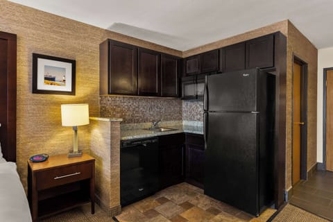 Premium bedding, desk, laptop workspace, iron/ironing board