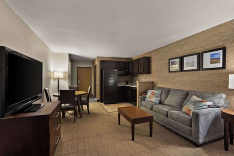 Premium bedding, desk, laptop workspace, iron/ironing board