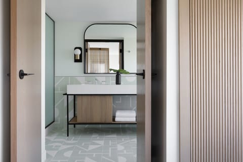 Designer toiletries, hair dryer, bathrobes, slippers