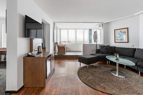 Suite, 1 Queen Bed, Jetted Tub, Sea View | Living area | 32-inch LCD TV with cable channels, TV, streaming services