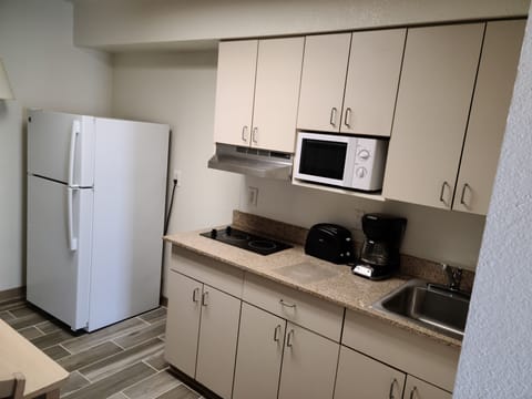 Suite | Private kitchen | Full-size fridge, microwave, toaster, cookware/dishes/utensils