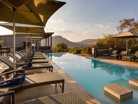 Outdoor pool, open 6:00 AM to 6:00 PM, pool umbrellas, sun loungers