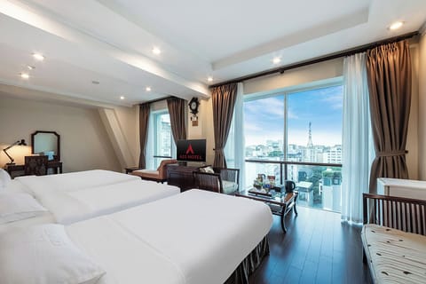 Family Suite | Minibar, in-room safe, blackout drapes, iron/ironing board