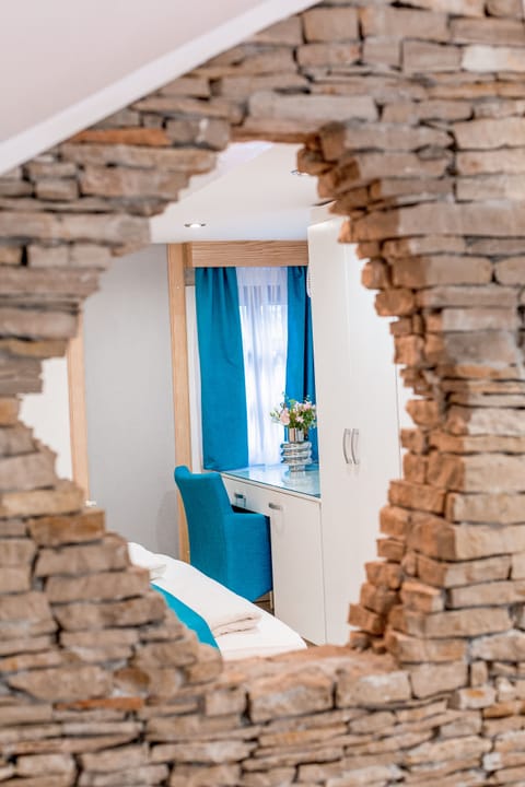 Standard Quadruple Room | Minibar, in-room safe, desk, soundproofing