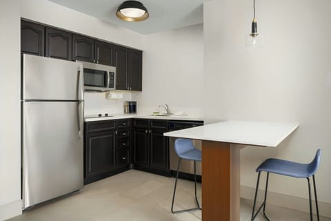 Suite, 1 Bedroom | Private kitchen | Full-size fridge, microwave, stovetop, dishwasher