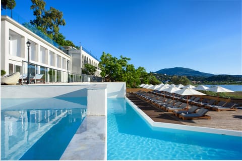 Outdoor pool, pool umbrellas, sun loungers