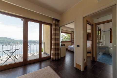 Luxury Suite, 1 Bedroom, Lake View | Living area | 50-inch LED TV with digital channels, Netflix, first-run movies