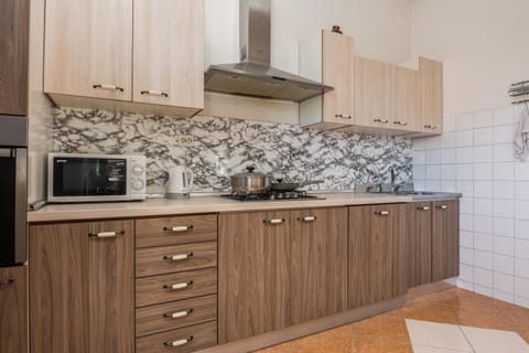 Family Apartment, Multiple Bedrooms, 2 Bathrooms (Pool Apartment Bakija) | Private kitchen | Fridge, microwave, oven, stovetop