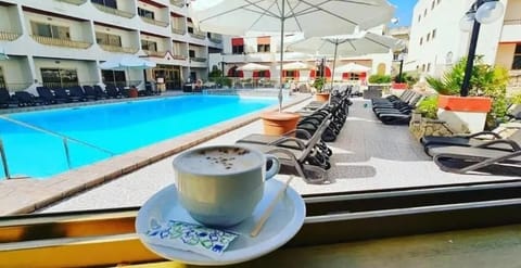 Outdoor pool, pool umbrellas, sun loungers