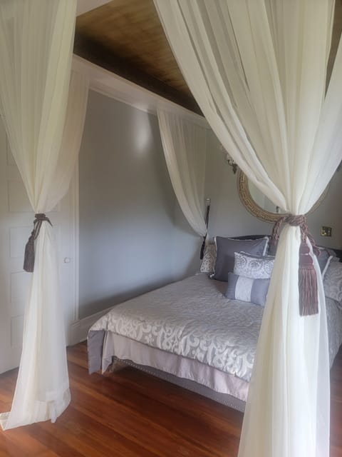 Burgundy Plum Room with shared bath | Premium bedding, individually decorated, individually furnished