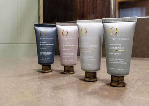 Shower, rainfall showerhead, designer toiletries, hair dryer