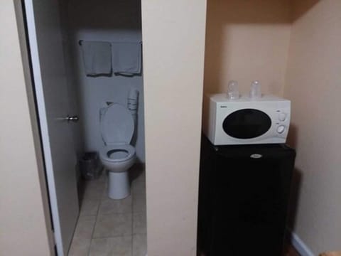 Desk, laptop workspace, blackout drapes, iron/ironing board