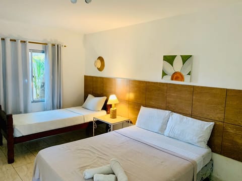 Economy Triple Room | Blackout drapes, rollaway beds, free WiFi, bed sheets