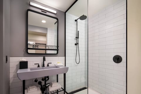 Shower, designer toiletries, hair dryer, towels