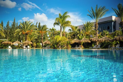 Indoor pool, outdoor pool, open 10 AM to 6 PM, pool umbrellas