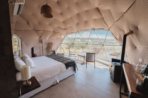 Luxury Tent (Domo Glamping) | Down comforters, pillowtop beds, minibar, desk