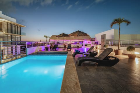 Outdoor pool, open 10:00 AM to 10:00 PM, pool umbrellas, sun loungers