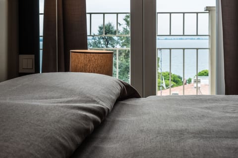 Double Room, Balcony, Lake View | Minibar, in-room safe, desk, laptop workspace