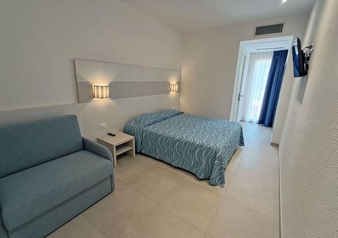 Superior Triple Room | Minibar, in-room safe, desk, blackout drapes