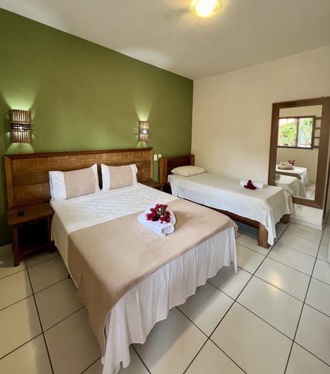 Superior Triple Room | Minibar, in-room safe, desk, iron/ironing board