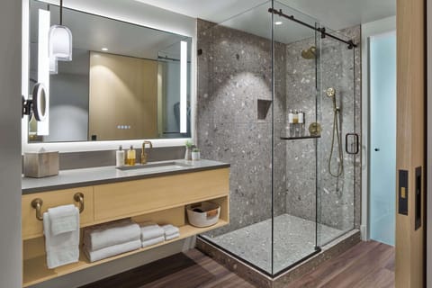 Designer toiletries, hair dryer, bathrobes, slippers