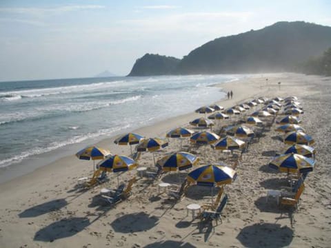 White sand, sun loungers, beach umbrellas
