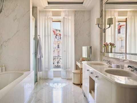 Designer toiletries, hair dryer, bathrobes, slippers