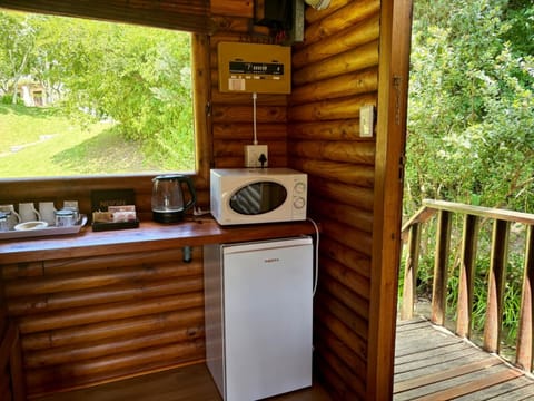 Family Room (Swiss Village) | Private kitchen | Coffee/tea maker, electric kettle