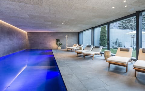 Indoor pool, pool umbrellas, sun loungers