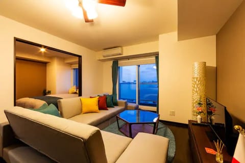 Apartment, Non Smoking | Living room | Flat-screen TV