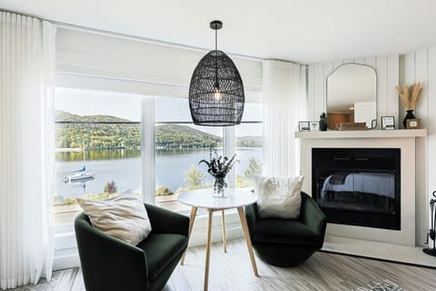 Design Studio, 1 Queen Bed, Kitchen, Lake View | Living area | 30-inch flat-screen TV with cable channels, TV, fireplace