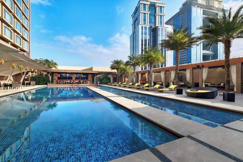 Outdoor pool, open 8:00 AM to 7:00 PM, pool umbrellas, sun loungers