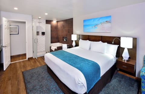 Junior Jacuzzi Suite | Desk, blackout drapes, iron/ironing board, cribs/infant beds