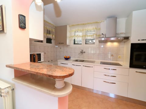 House (One Bedroom Holiday Home with Terrace) | Private kitchen | Fridge, microwave, stovetop, dishwasher