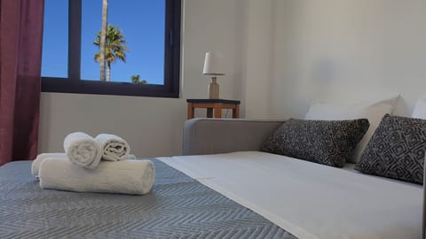 Family Suite, Garden View | Living area | 32-inch flat-screen TV with cable channels, TV