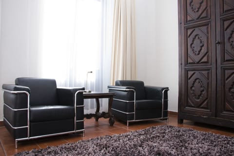 Quadruple Room | Living area | 50-inch Smart TV with digital channels