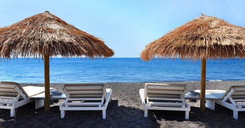 On the beach, black sand