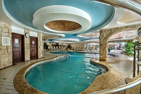 Indoor pool, outdoor pool, open 7 AM to 11 PM, pool umbrellas