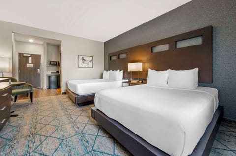 Premium bedding, desk, laptop workspace, iron/ironing board