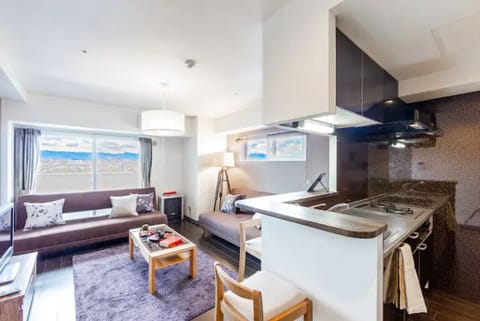 Apartment, Non Smoking | Living area | Flat-screen TV