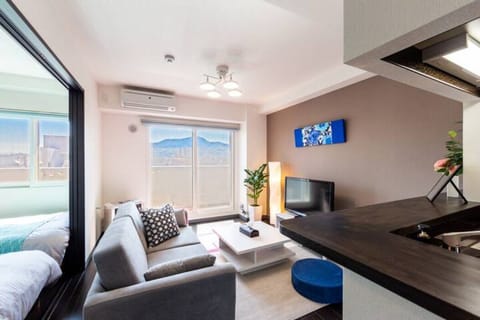 Apartment, Non Smoking | Living area | Flat-screen TV