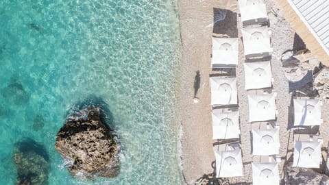 Private beach nearby, free beach shuttle, beach umbrellas, beach towels